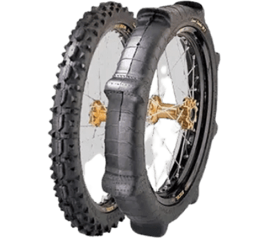A close up of two tires on the ground