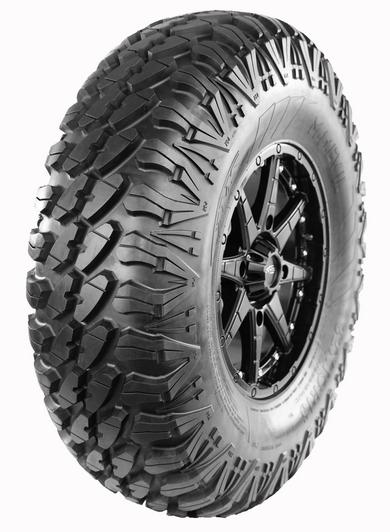 A close-up of an off-road tire with a detailed tread pattern and a visible black alloy wheel.